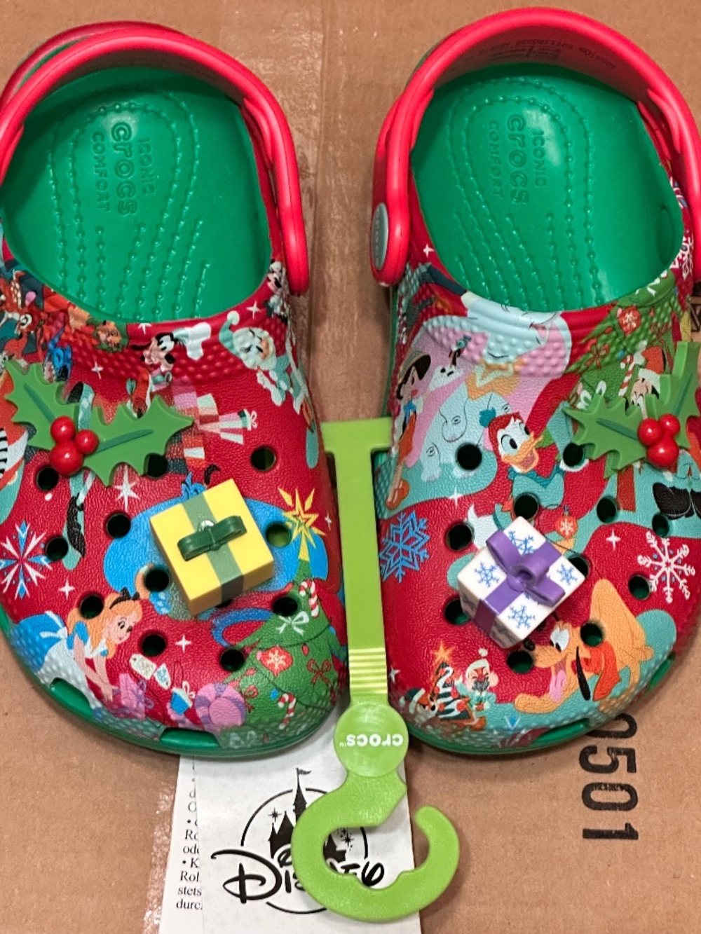 Disney Parks holiday clogs by Crocs feature a festive all-over character print a